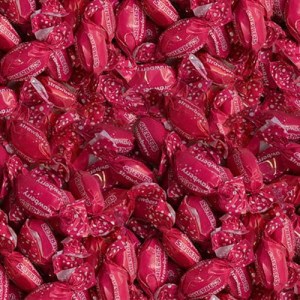 Close-up of bright pink Strawberry Sherbet Shots wrapped in pink foil