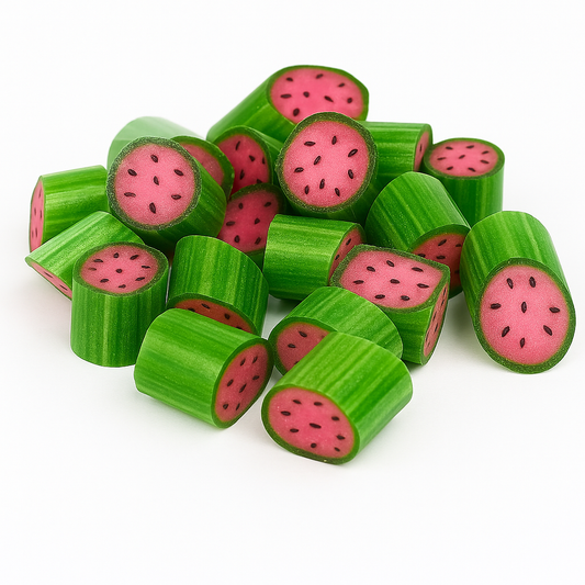 “Close-up of bright green and pink watermelon rock candies with black seed details, showing glossy surfaces and striped outer layers in a vibrant pile.”