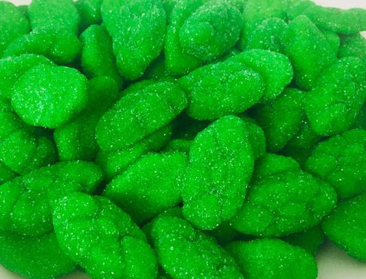 Bright green sugar-coated watermelon cloud lollies with a soft, fluffy texture, piled together on a white background.