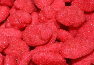 Soft red and white strawberry-shaped cloud lollies coated in sugar, displayed on a white background showing their fluffy, chewy texture.